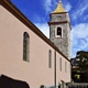 Gadoni-chiesa parrocchiale della Beata Vergine Assunta: l’imponente torre campanaria vista davanti